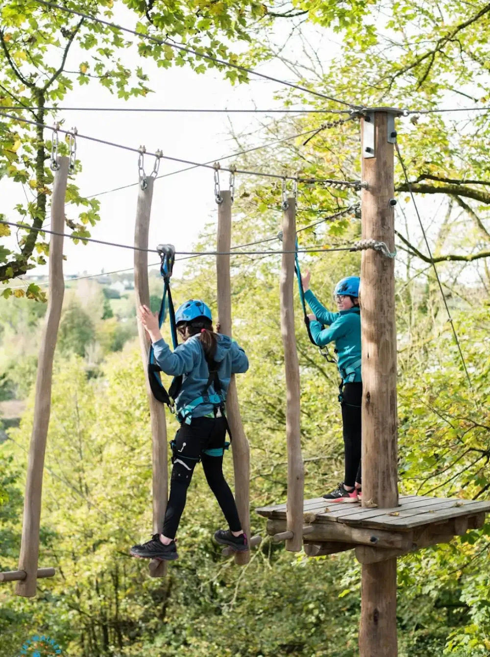 Freestanding pole high ropes course structure