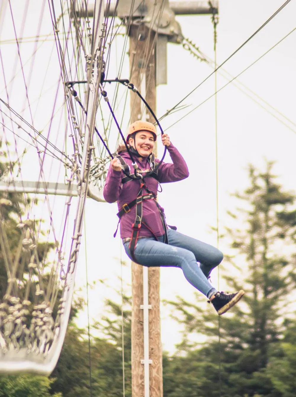 ZipCoaster roller coaster zipline in action at an outdoor adventure park