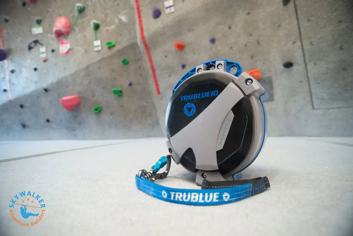 Climber safely resting mid-route using the TRUBLUE iQ+ Catch-and-Hold feature